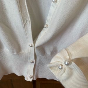 Cream/Ivory cardigan. Satin and pearls